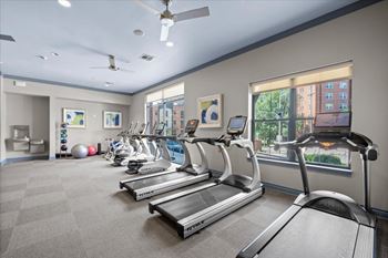 A gym with treadmills and exercise equipment. at 46 Penn Apartment Homes, Kansas City, MO, 64111